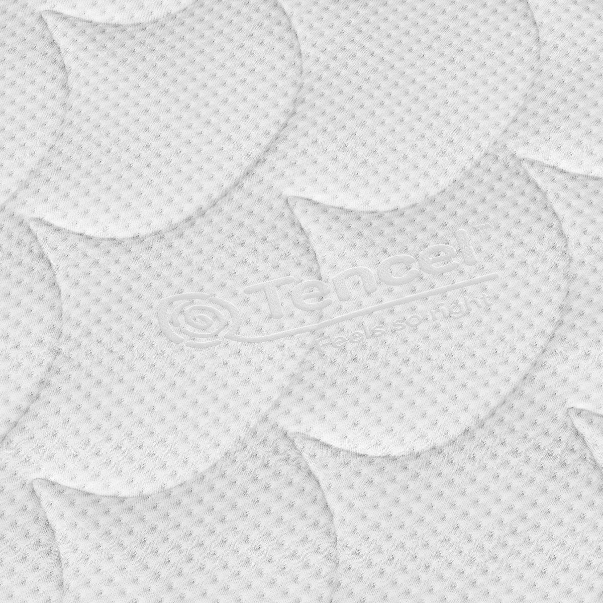 Close-up van de Topdekmatras - NASA Schuim Tencel Tijk's witte structuurstof met herhalend bladpatroon, kleine stippen, Tencel-logo in reliëf en "Feels so right"-ontwerp voor comfort en extra drukontlasting.