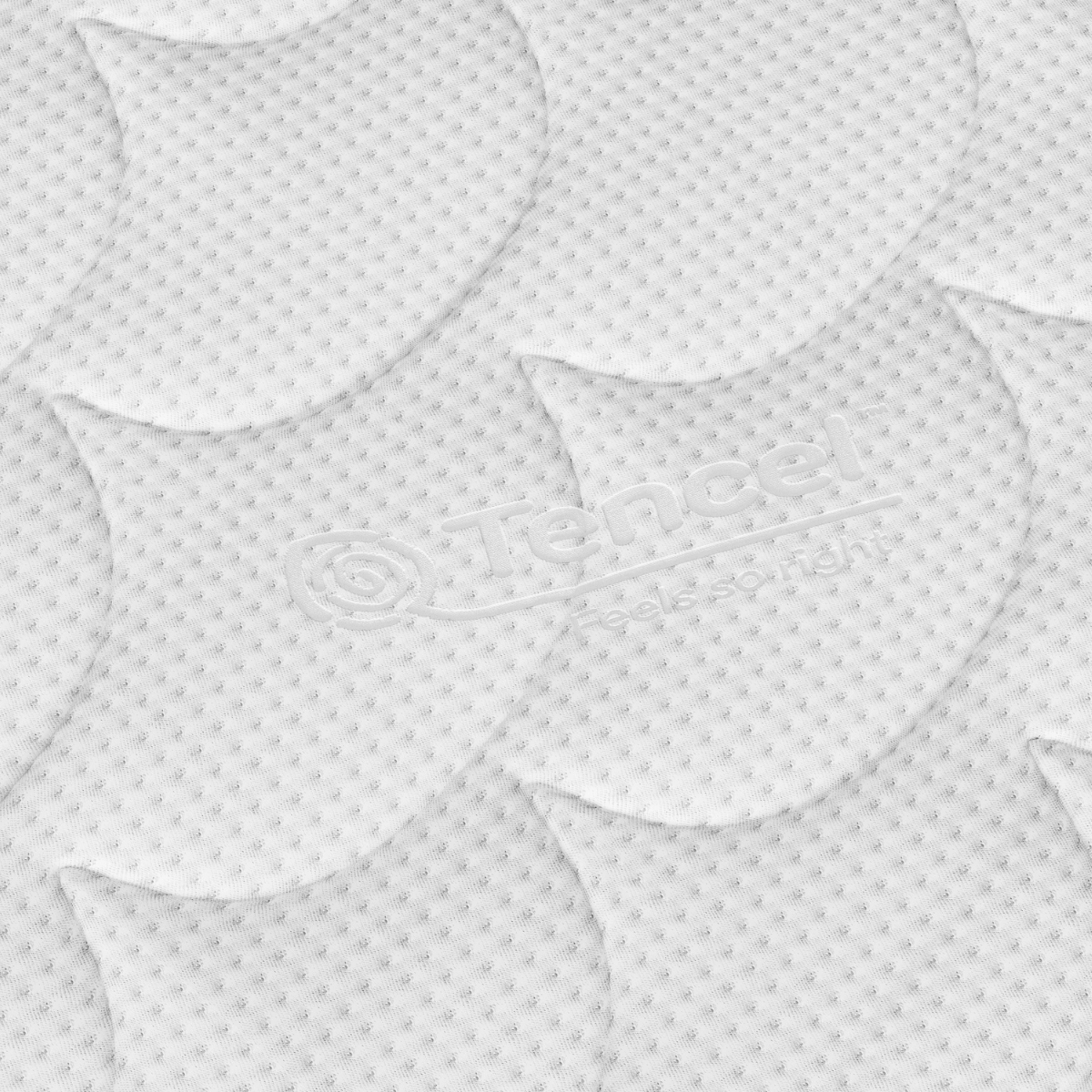 Witte Tencel-textuur met een bladachtig reliëfpatroon biedt huisstofmijtwerend en drukverlagend comfort. Het Tencel-logo en "Feels so right" zijn zichtbaar, waardoor de Topdekmatras - Hybride Koudschuim Tencel Tijk perfect is voor je matras.