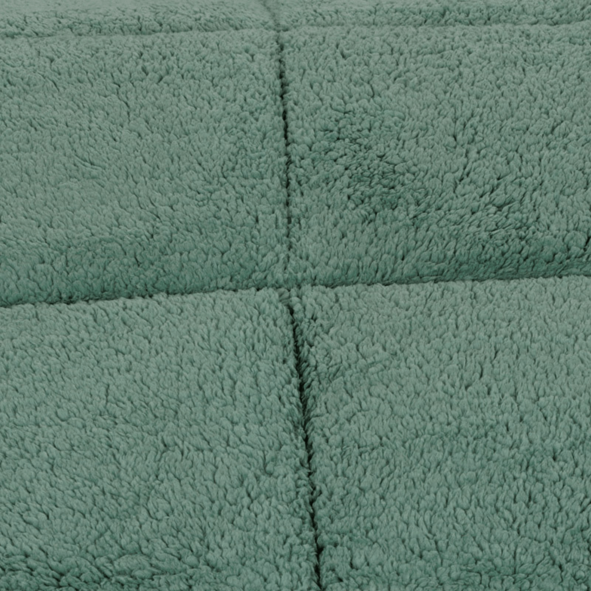 Close-up van een zachte, gestructureerde, groene teddystof fleece stof met zichtbare gestikte rasternaden, perfect voor het knusse Zelesta Teddybed - Groen.