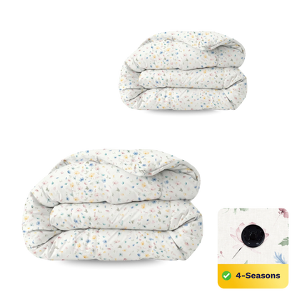 Twee gevouwen witte dekbedden met pastelkleurige bloemenprint. Inzet benadrukt de temperatuurregulerende stof en een "4-Seizoenen" label. Ervaar perfect comfort met de Zelesta Wonderbed 4 Seasons Double - Spring Bloom collectie.