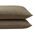Twee taupe Zelesta Velvetbed Chique kussenslopen met een subtiel verticaal streeppatroon zijn gestapeld tegen een witte achtergrond en bieden blijvend comfort en stijl. Deze set bestaat uit 2 duurzame kussenslopen.