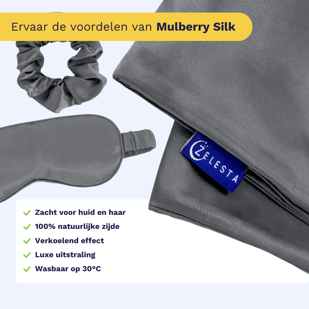 De Zelesta Sleeping Beauty Set - Amazing Anthracite, bestaande uit een grijze zijden scrunchie, slaapmasker en Mulberry zijden kussensloop met een Celesta label, wordt getoond op een lichte achtergrond met anti-aging Mulberry zijde voordelen.