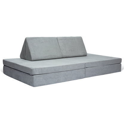 De BAAAP - De geliefde speelbank - Grace of Grey is een grijze modulaire vloerbank met twee driehoekige rugleuningen en een opvouwbaar ontwerp, ideaal voor kinderen om te relaxen of om ruimtelijk inzicht te ontwikkelen tijdens het spelen.