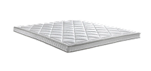 Een wit zelesta topper voor op het bed